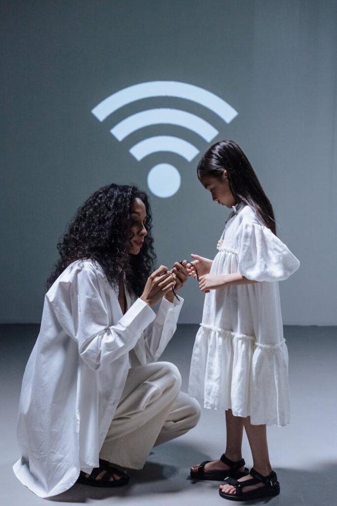 Mother giving daughter smartwatch